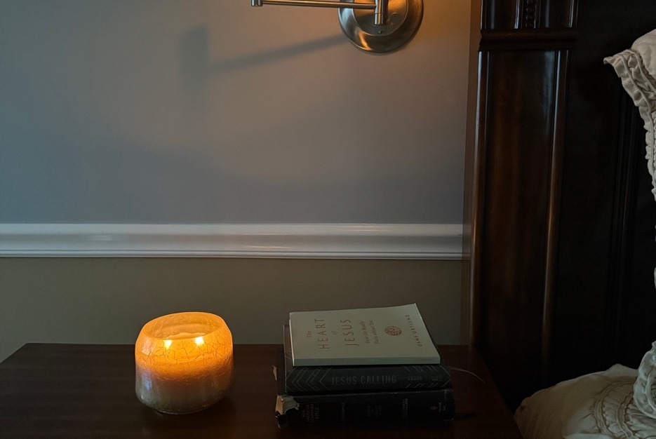 Nightstand with candle and books