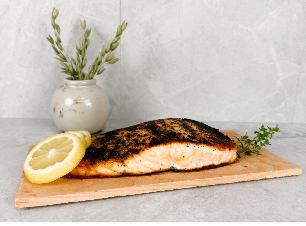 A close view of a seared salmon fillet showing the crust and the tender interior